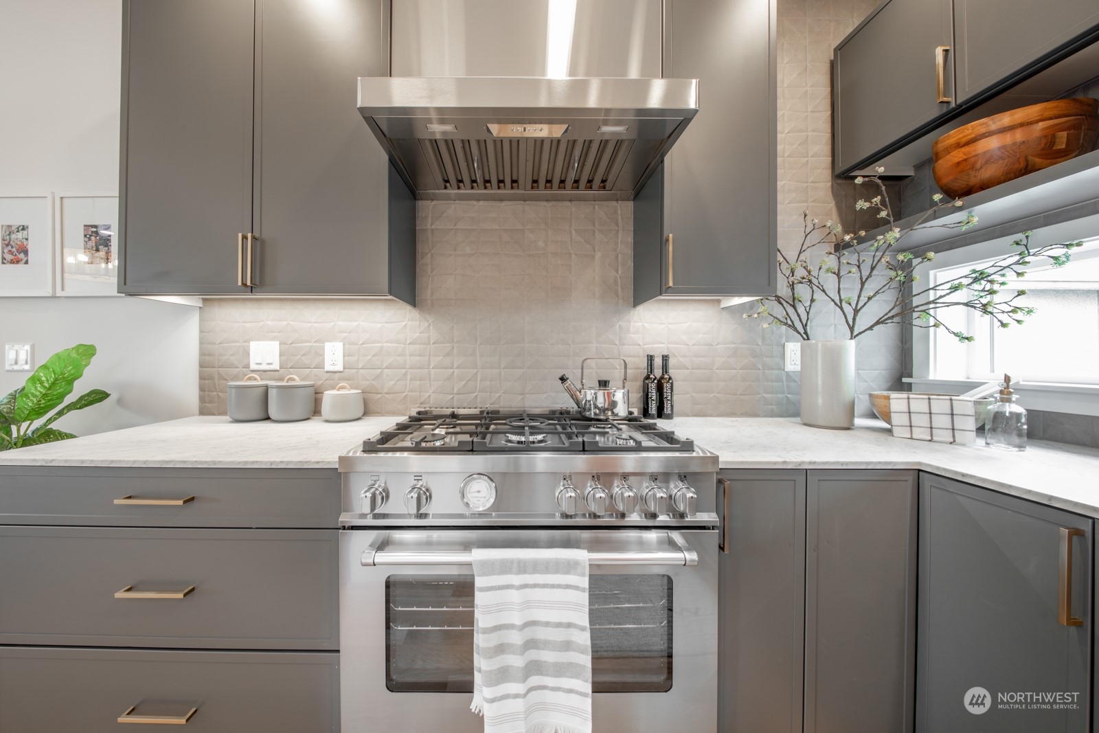 3649 Francis Avenue North, Unit A Seattle, WA 98103 - Photo 13 of 35 a stove top oven sitting inside of a kitchen
