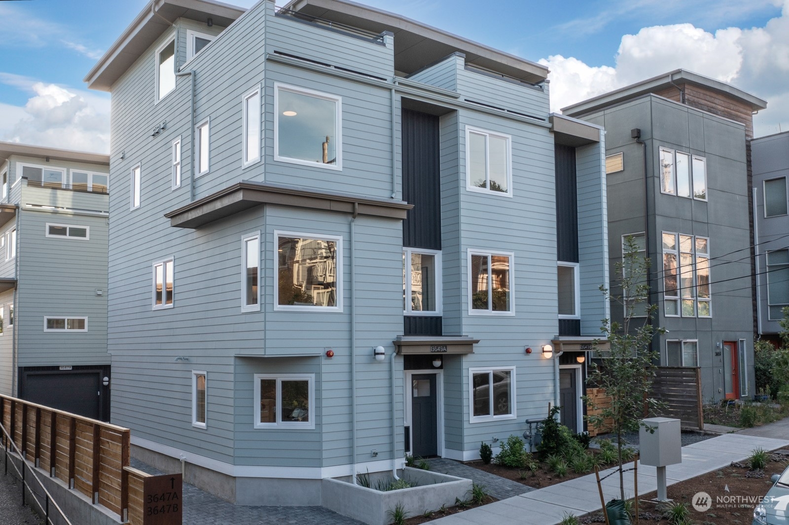 3649 Francis Avenue North, Unit A Seattle, WA 98103 - Photo 2 of 35 a front view of a multi story residential apartment building