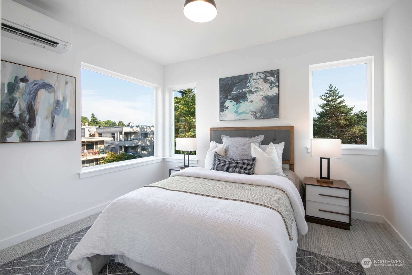 3649 Francis Avenue North, Unit A Seattle, WA 98103 - Photo 23 of 35 a bedroom with a large bed and a window