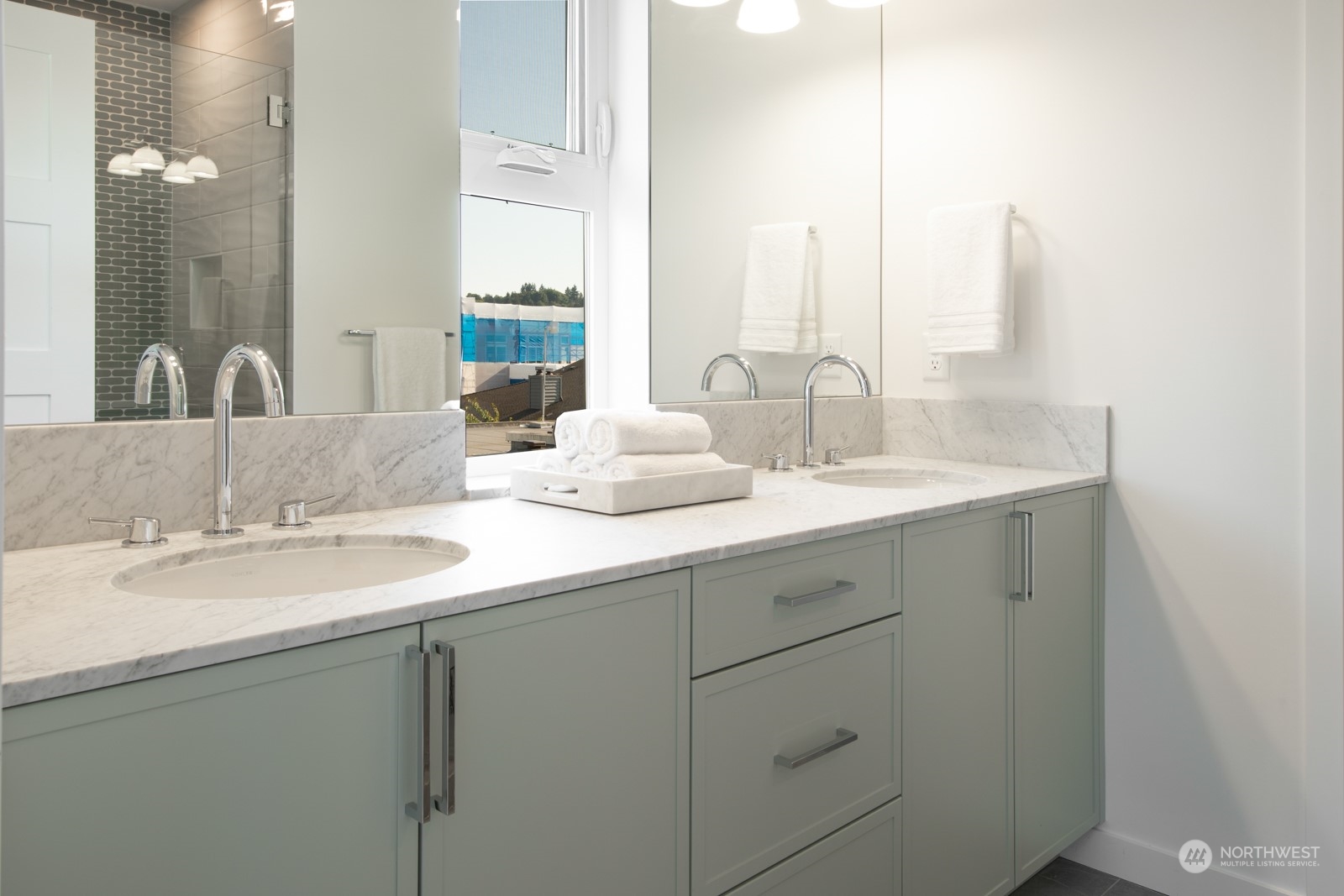 3649 Francis Avenue North, Unit A Seattle, WA 98103 - Photo 26 of 35 a bathroom with a double vanity sink and a mirror