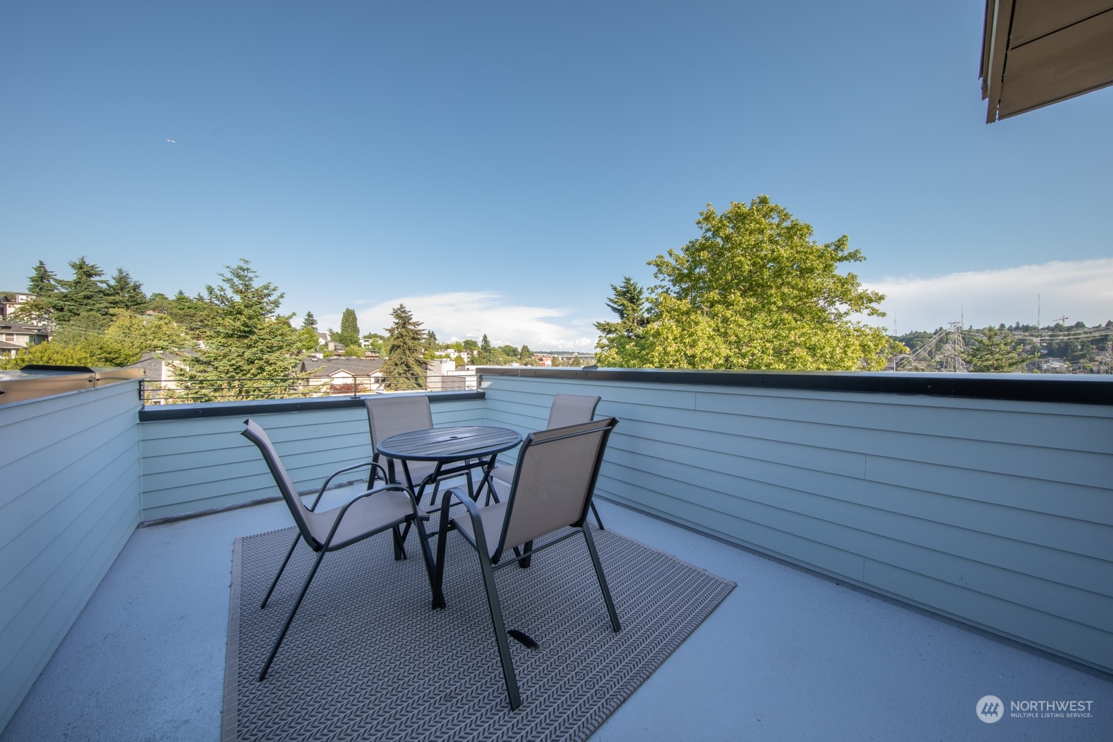 3649 Francis Avenue North, Unit A Seattle, WA 98103 - Photo 31 of 35 a view of a chairs and table on the terrace