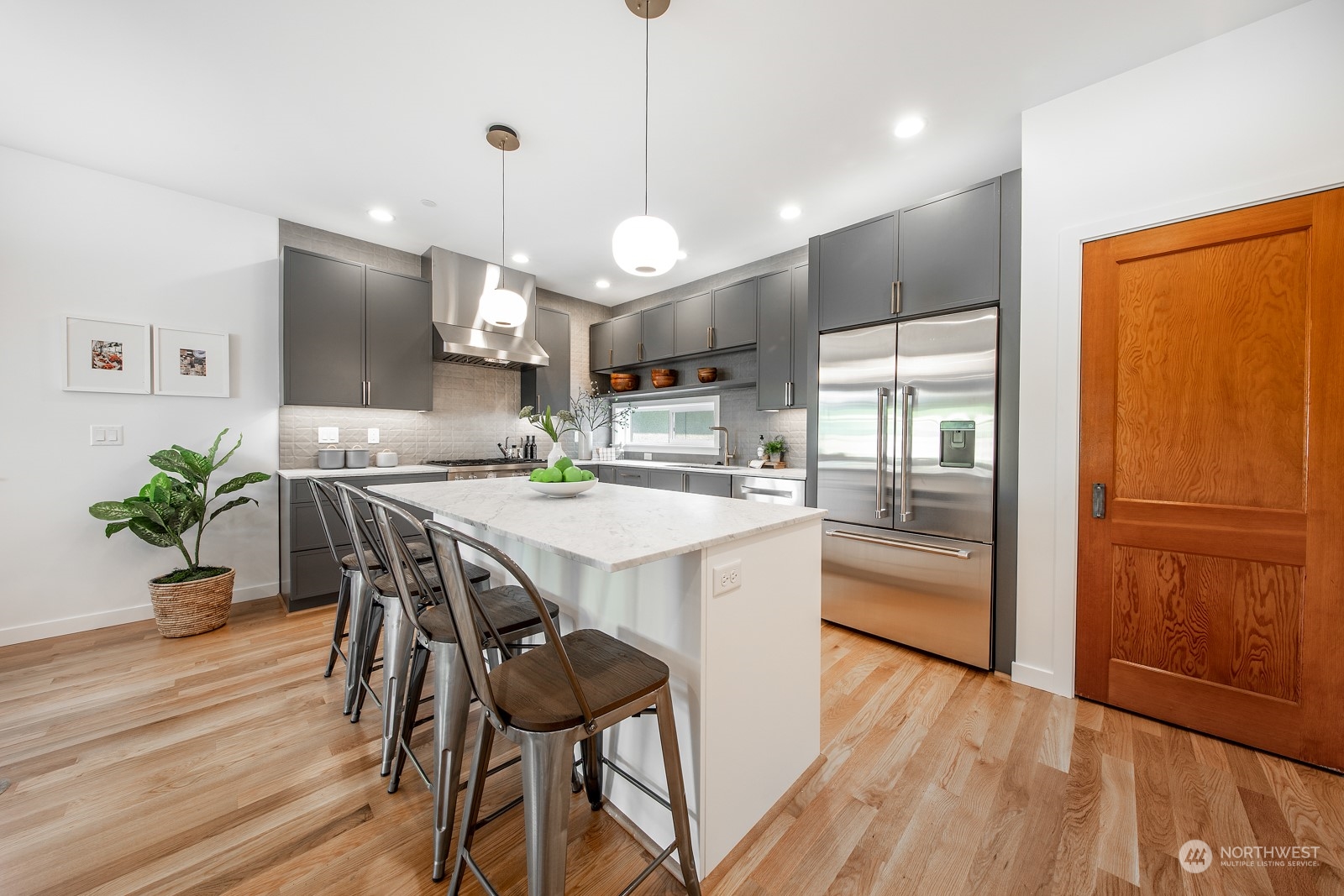 3649 Francis Avenue North, Unit A Seattle, WA 98103 - Photo 6 of 35 a kitchen with a table and chairs in it