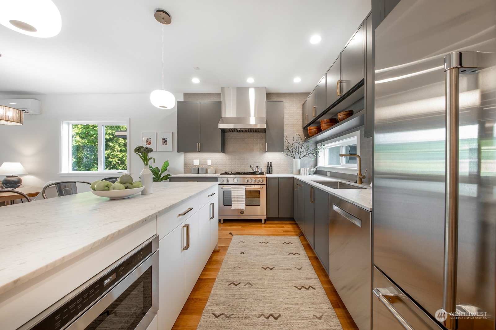 3649 Francis Avenue North, Unit A Seattle, WA 98103 - Photo 10 of 35 a large kitchen with stainless steel appliances lots of counter space a sink and a large window
