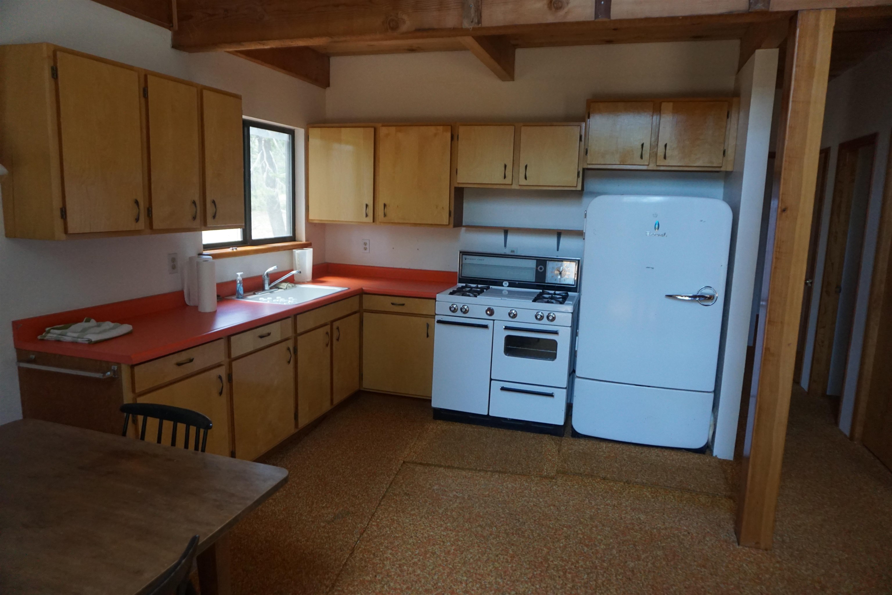 1334 Highlands Road Quincy, CA 95971 - Photo 7 of 47 a kitchen with stainless steel appliances granite countertop a sink stove and refrigerator