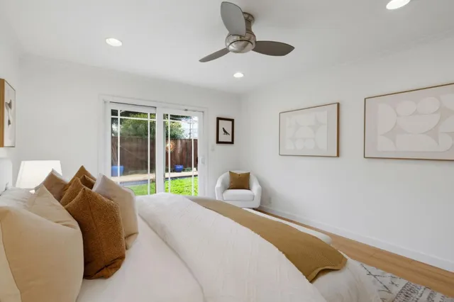 a bedroom with a large bed and a large window