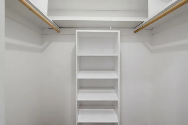 a view of an empty walk in closet