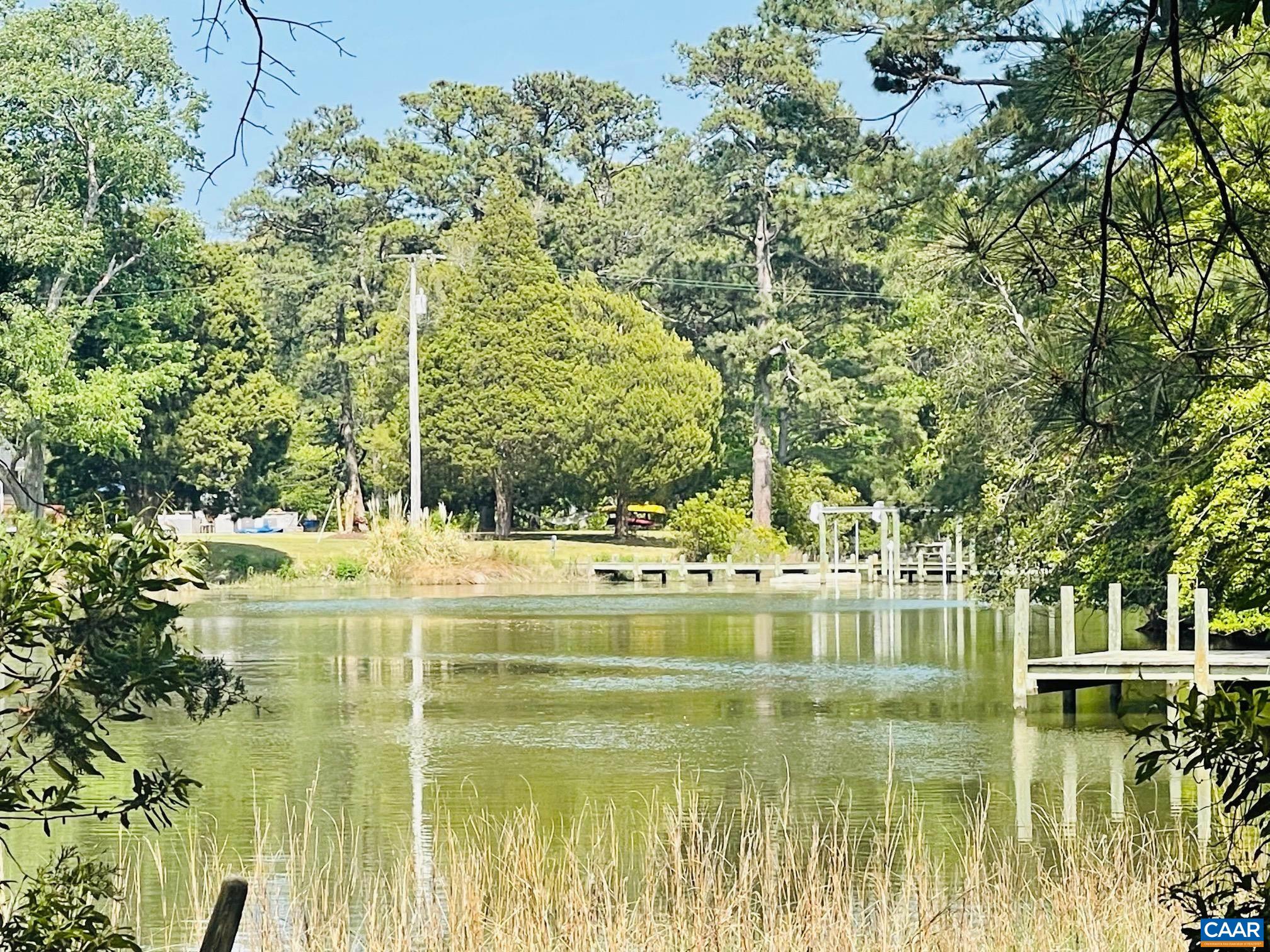 a view of swimming pool from a lake view