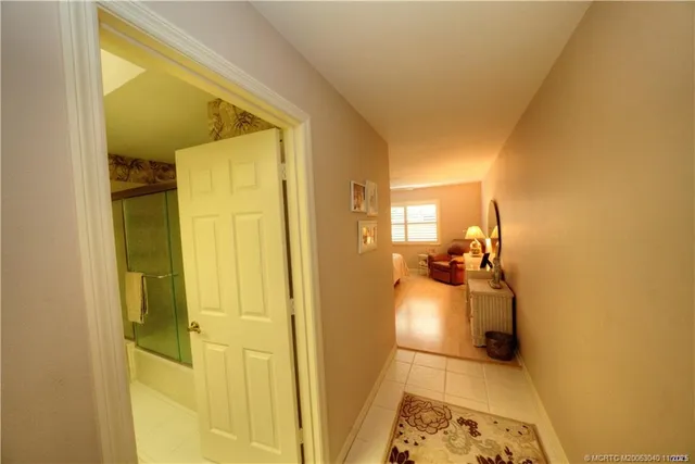 a living room with furniture and painting on the wall