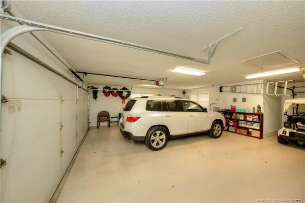 a view of a dining room with furniture and a table