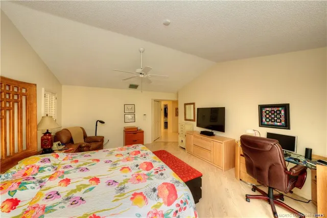 a living room with furniture and chandelier