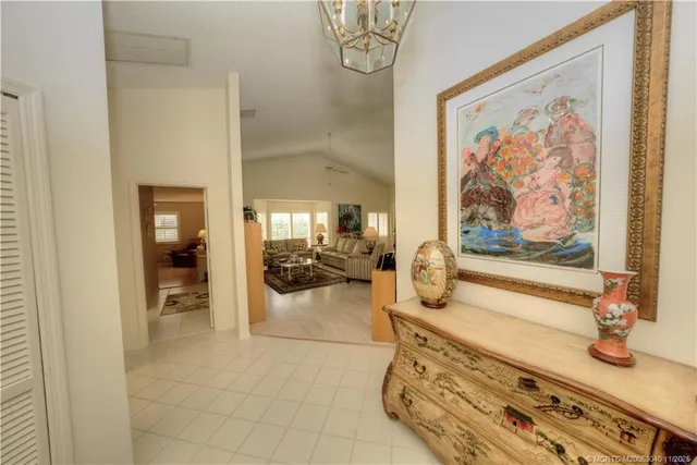 a living room with furniture and flowers