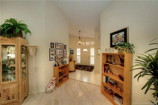 a view of a bedroom with wooden floor and bathroom