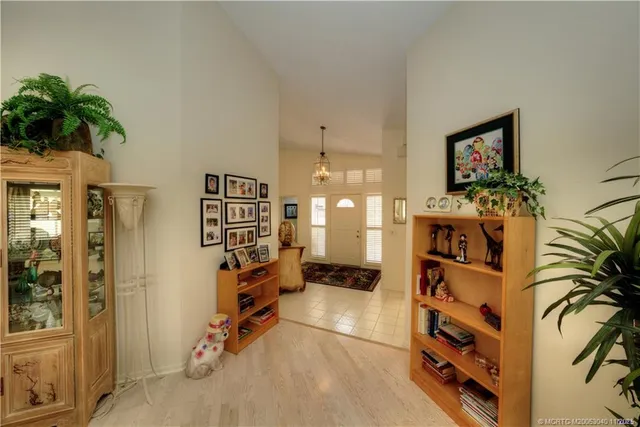 a view of a bedroom with wooden floor and bathroom