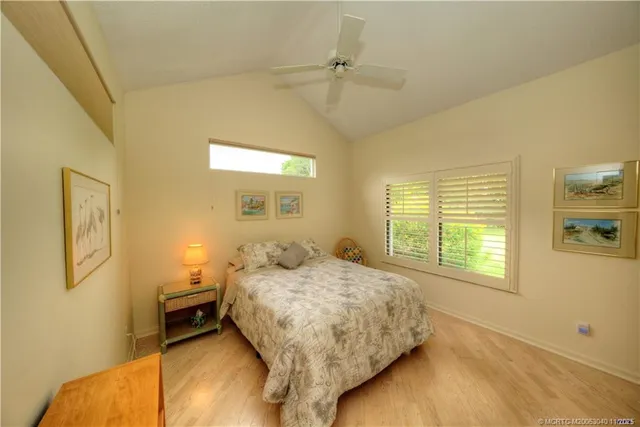 a bathroom with a tub sink shower and a mirror