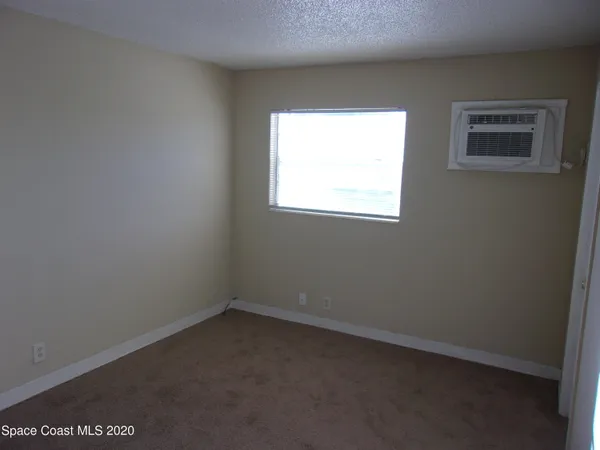 a view of empty room with windows