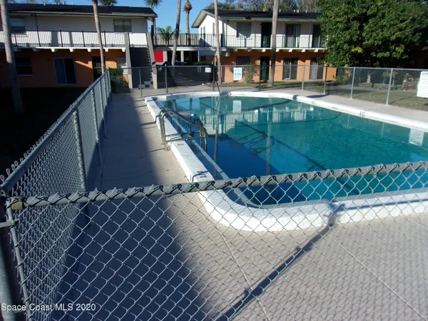 a view of a swimming pool with a patio