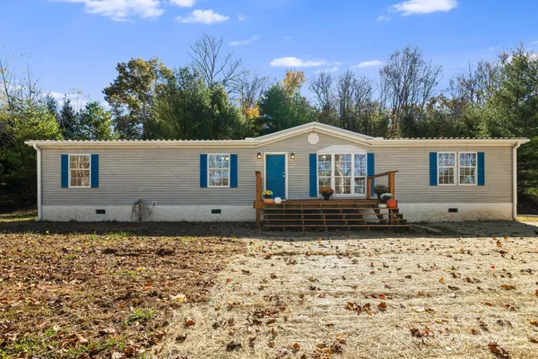 a house with trees in the background