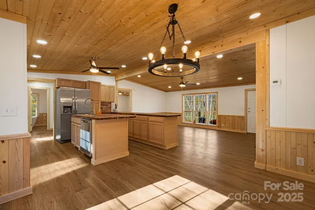 a view of a kitchen and dining room with a chandelier