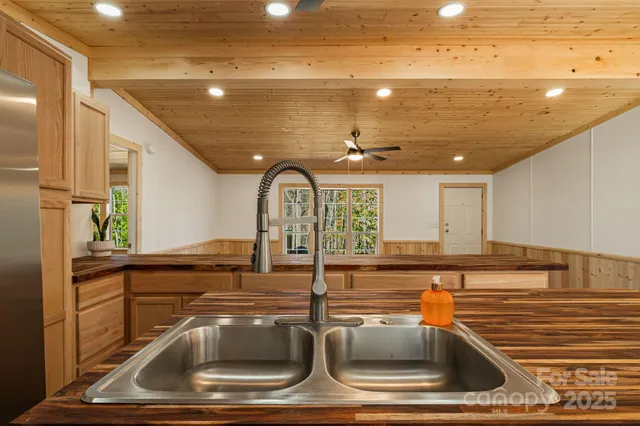 a view of a kitchen with a sink and dishwasher