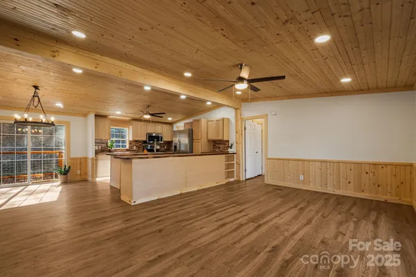 a view of kitchen with microwave and cabinets