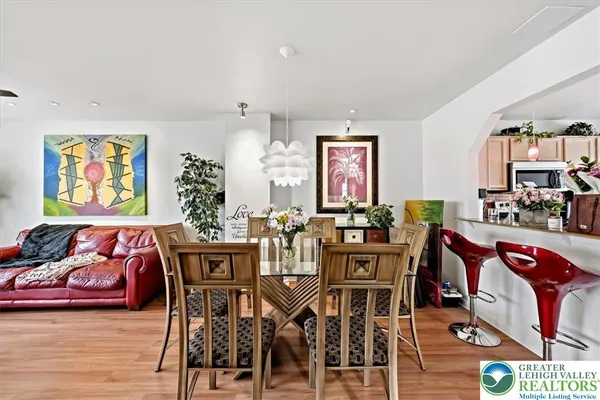 a view of a dining room with furniture and wooden floor