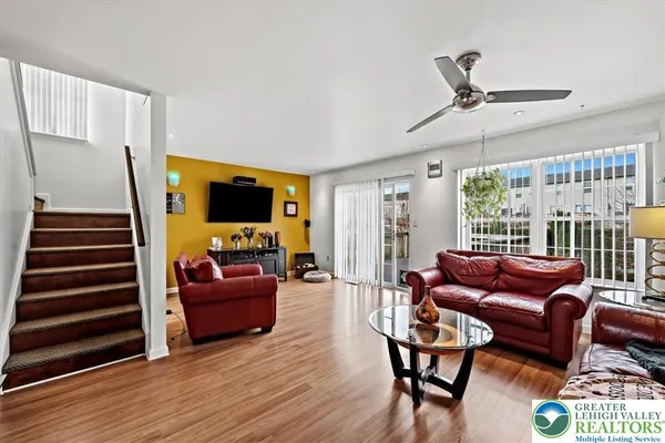 a living room with furniture and a flat screen tv
