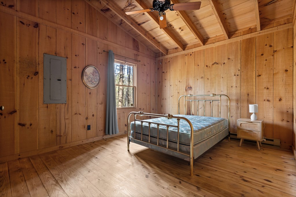 104 Big Tree Road Suches, GA 30572 - Photo 4 of 19 a bedroom with a bed and a window