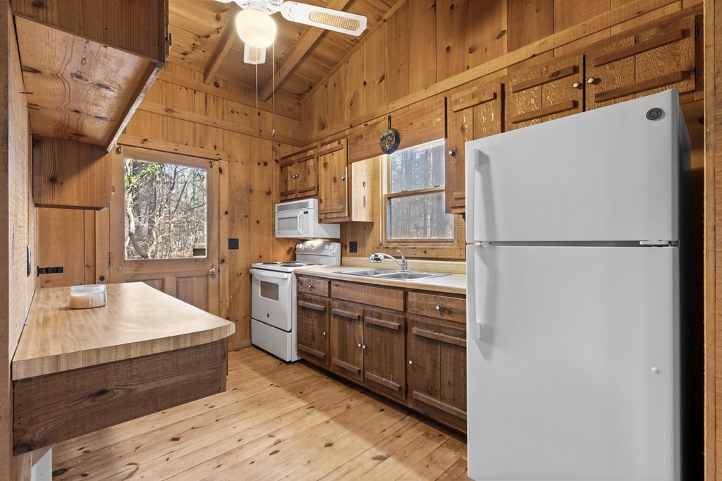 104 Big Tree Road Suches, GA 30572 - Photo 5 of 19 a kitchen with sink cabinets and refrigerator