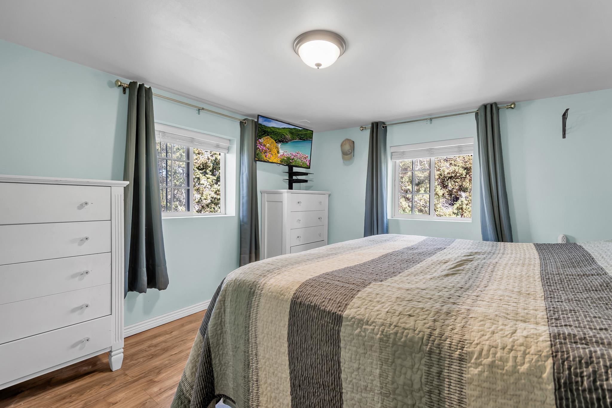 24413 Ute Trail Road Cedaredge, CO 81413 - Photo 16 of 40 a bedroom with a bed and a window