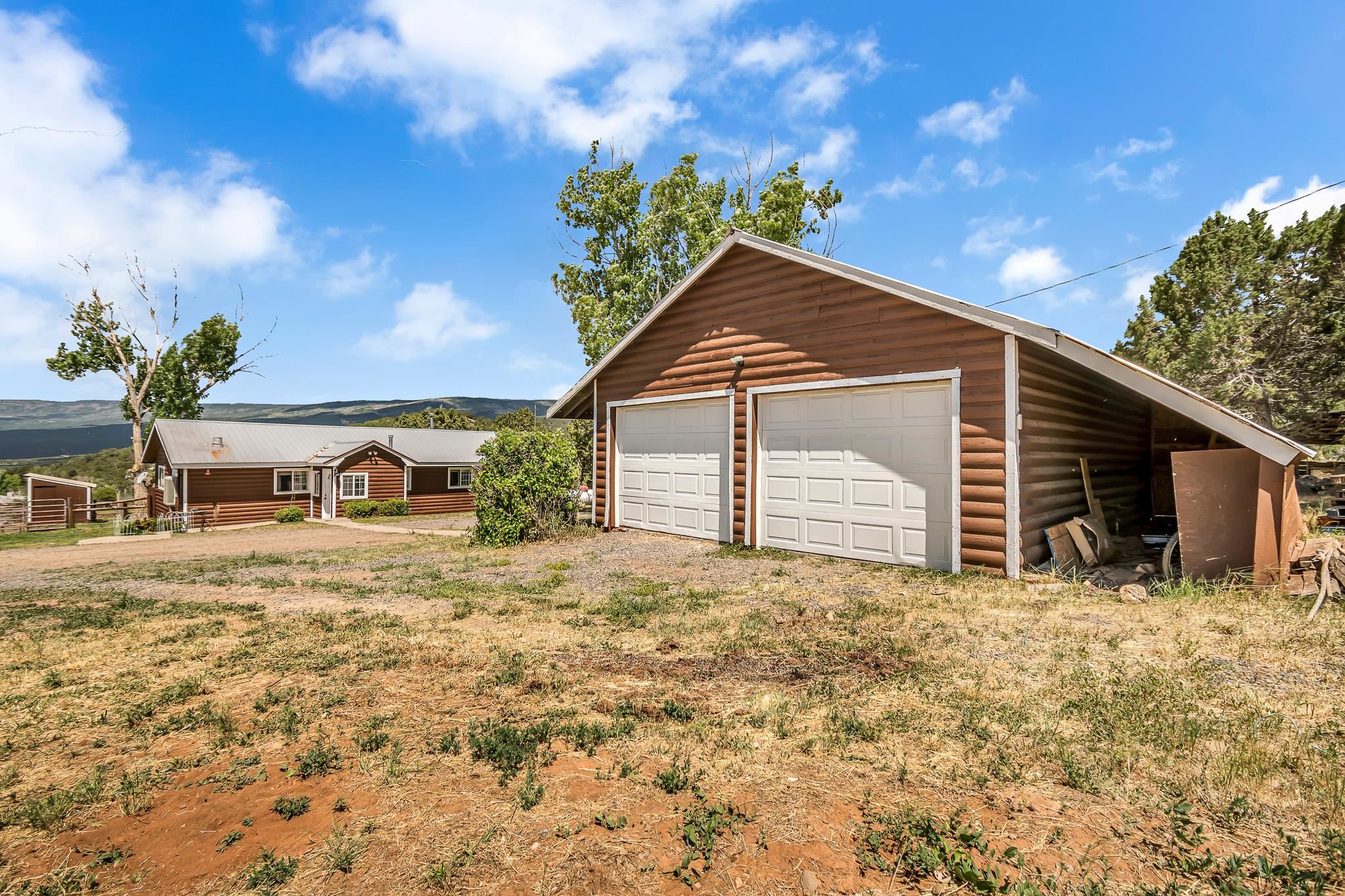 24413 Ute Trail Road Cedaredge, CO 81413 - Photo 2 of 40 a view of a house with a yard