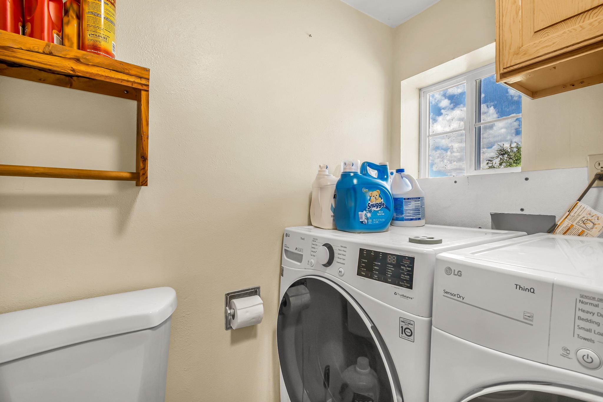 24413 Ute Trail Road Cedaredge, CO 81413 - Photo 21 of 40 a utility room with dryer and washer