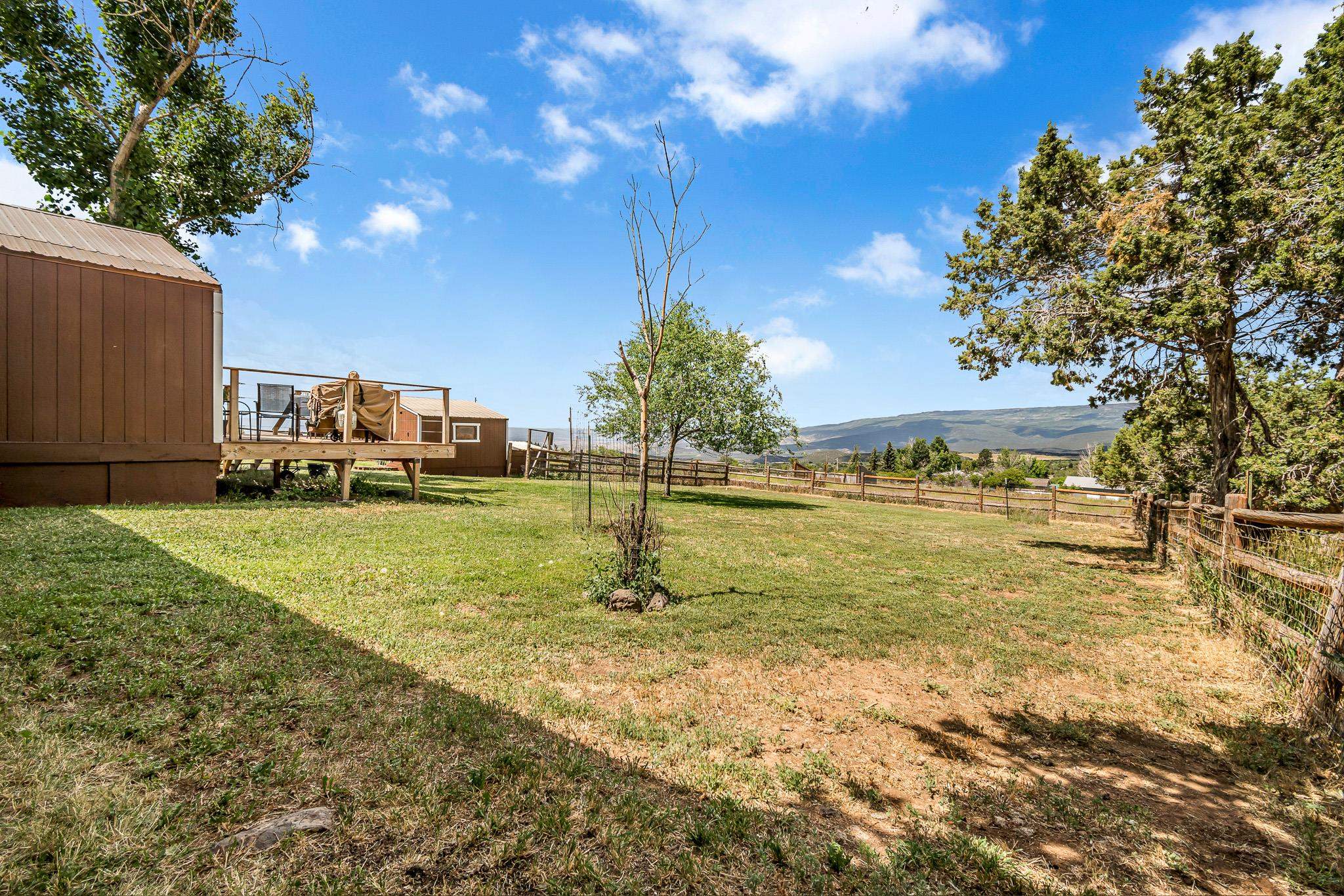 24413 Ute Trail Road Cedaredge, CO 81413 - Photo 25 of 40 a swimming pool with outdoor seating and yard