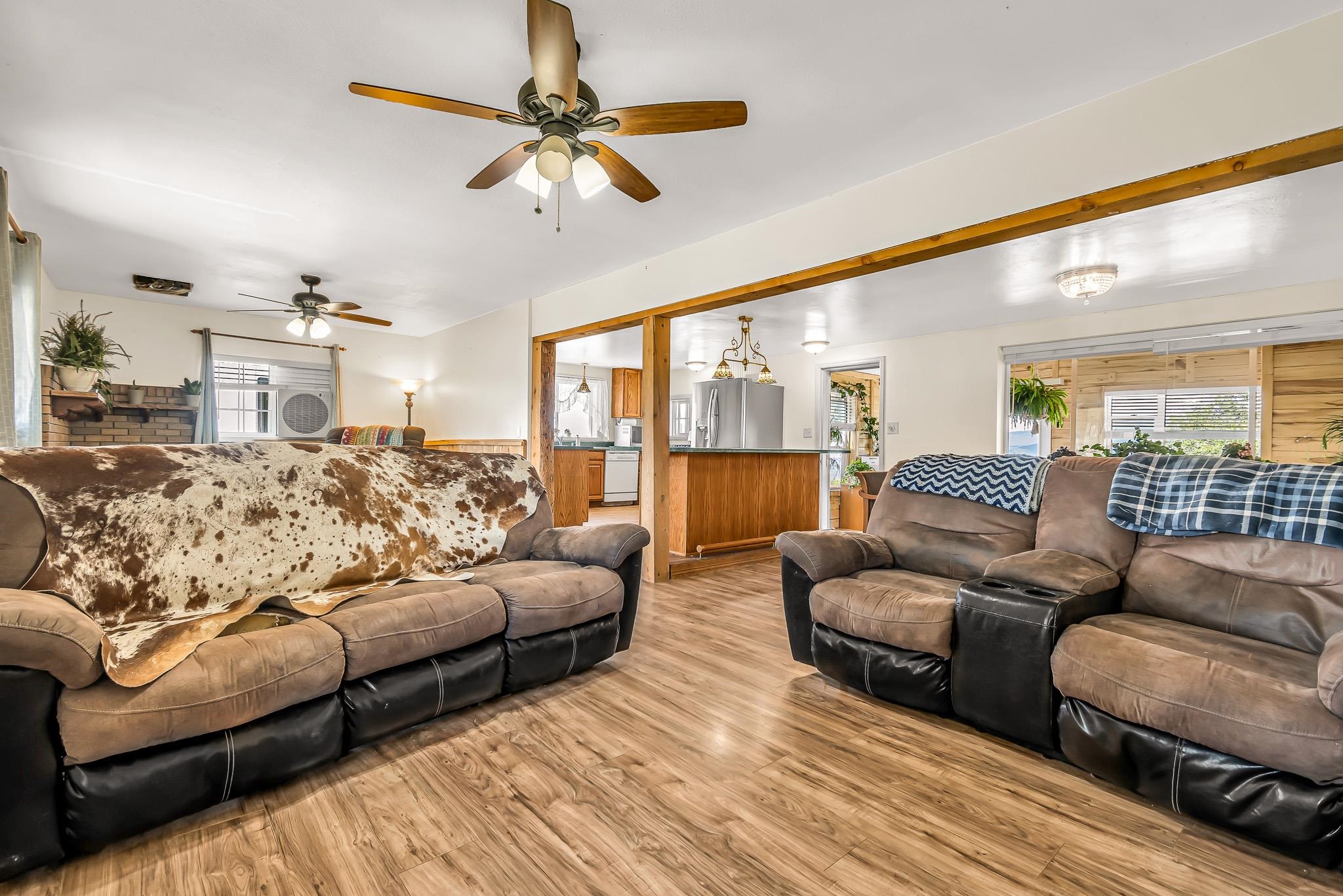 24413 Ute Trail Road Cedaredge, CO 81413 - Photo 3 of 40 a living room with furniture and a large window