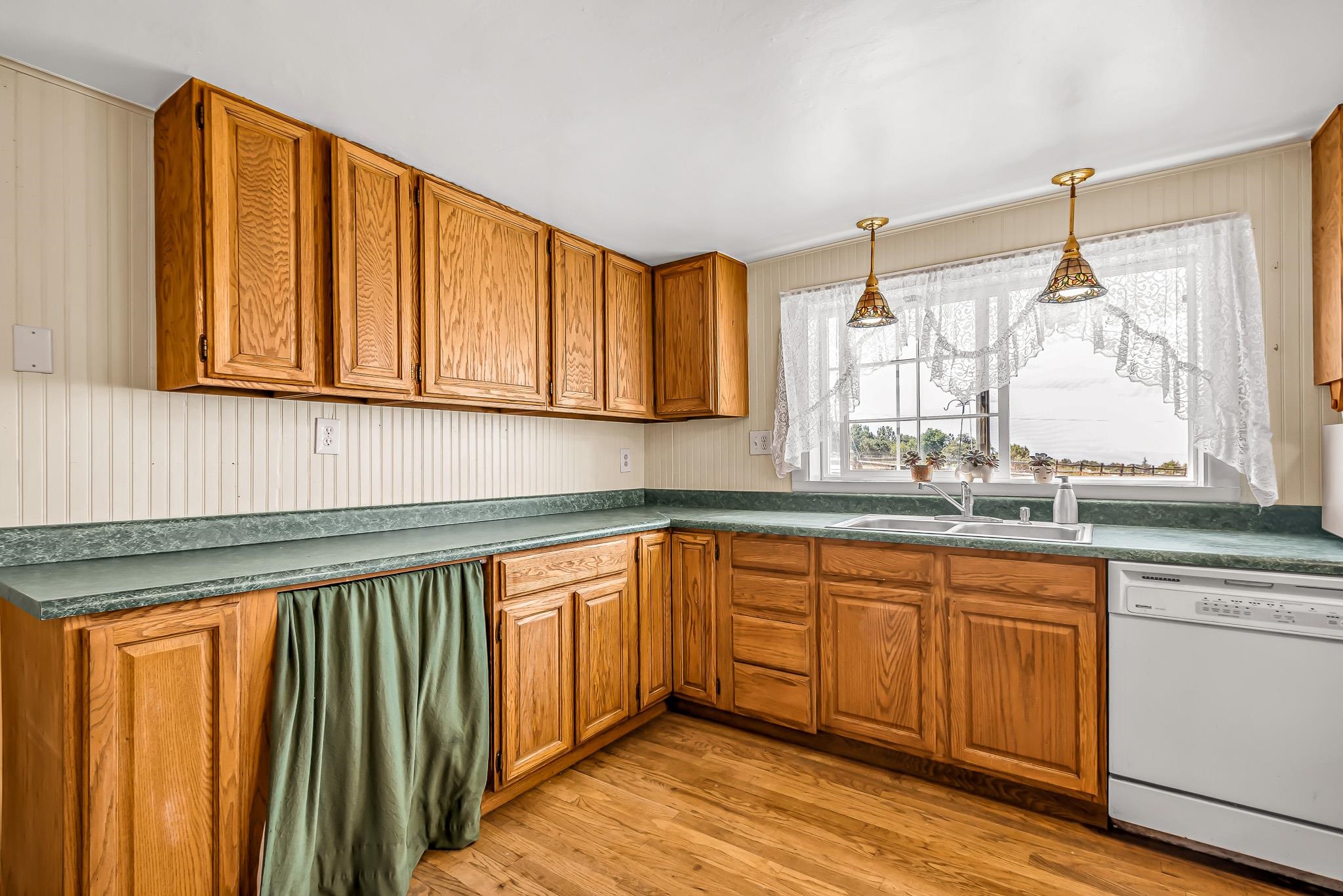 24413 Ute Trail Road Cedaredge, CO 81413 - Photo 8 of 40 a kitchen with a sink and cabinets