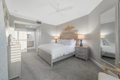 a bedroom with a bed and a view of bedroom