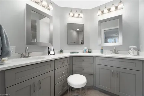a bathroom with a sink double vanity and a mirror