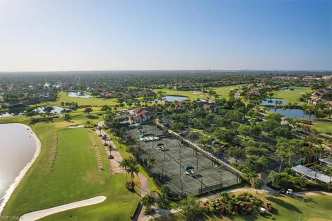 an aerial view of residential building and lake