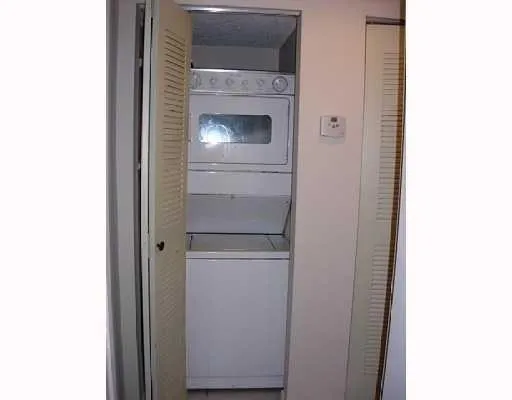 a close view of a utility room with washer and dryer