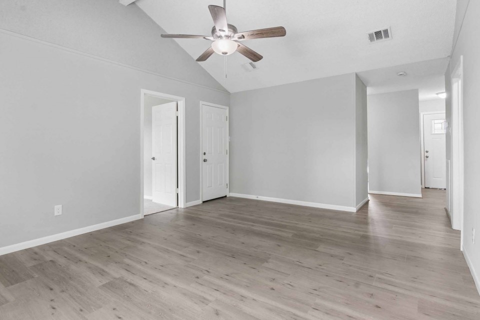 7403 Strawbridge Lane Houston, TX 77040 - Photo 5 of 22 a view of an empty room with a ceiling fan