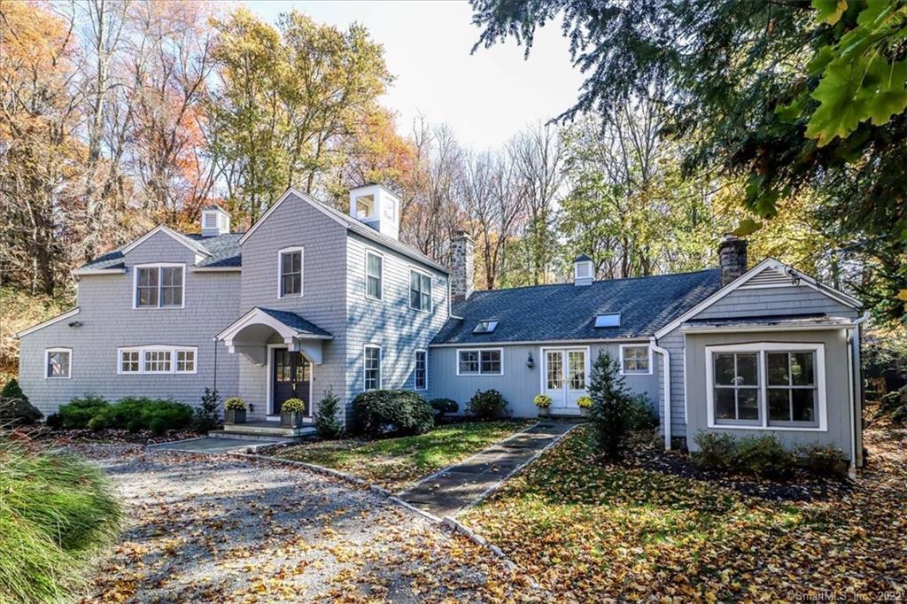 11 Millstone Road Wilton, CT 06897 - Photo 1 of 1 a front view of a house with a yard