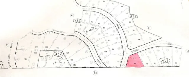 a black and white photo of a bench