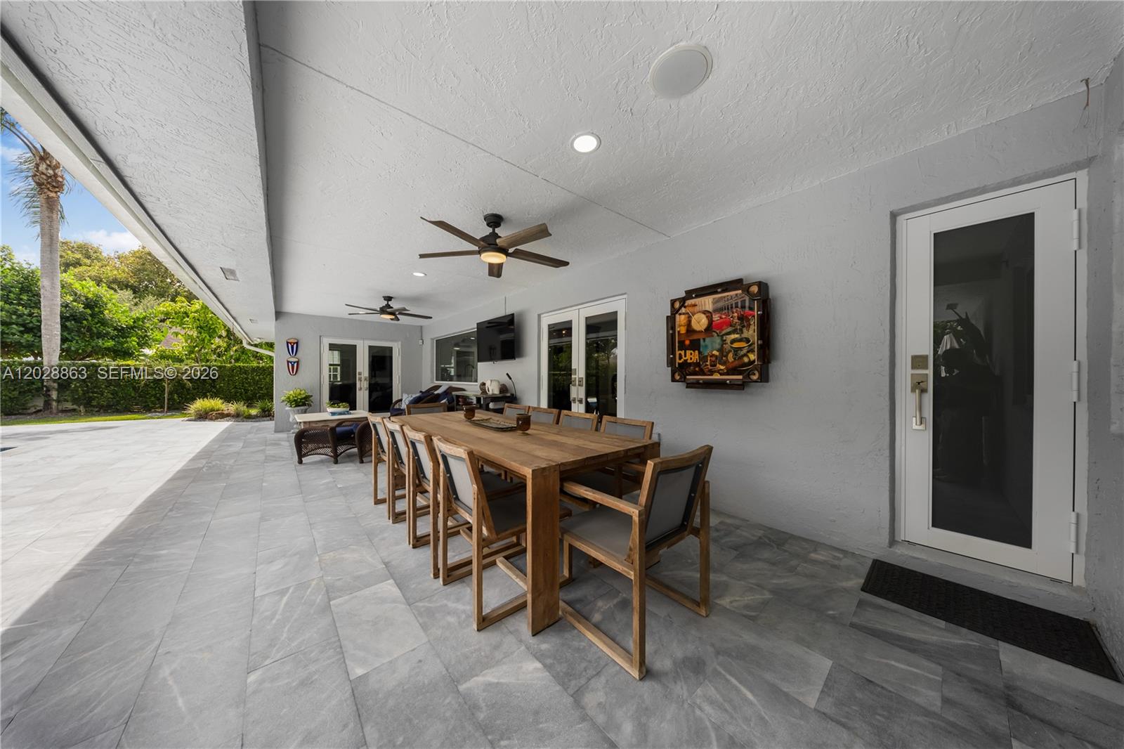 15351 Southwest 146th Street Miami, FL 33196 - Photo 62 of 86 Rain gutters keep the water out from the terrace - easy access to Cabana bath.
