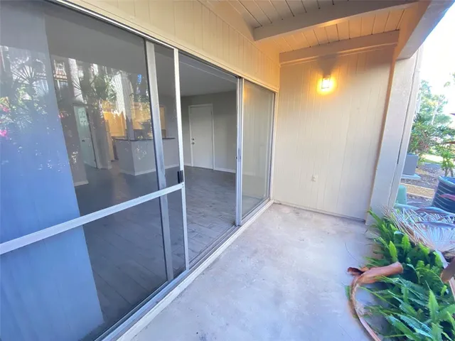 a view of gallery with wooden floor