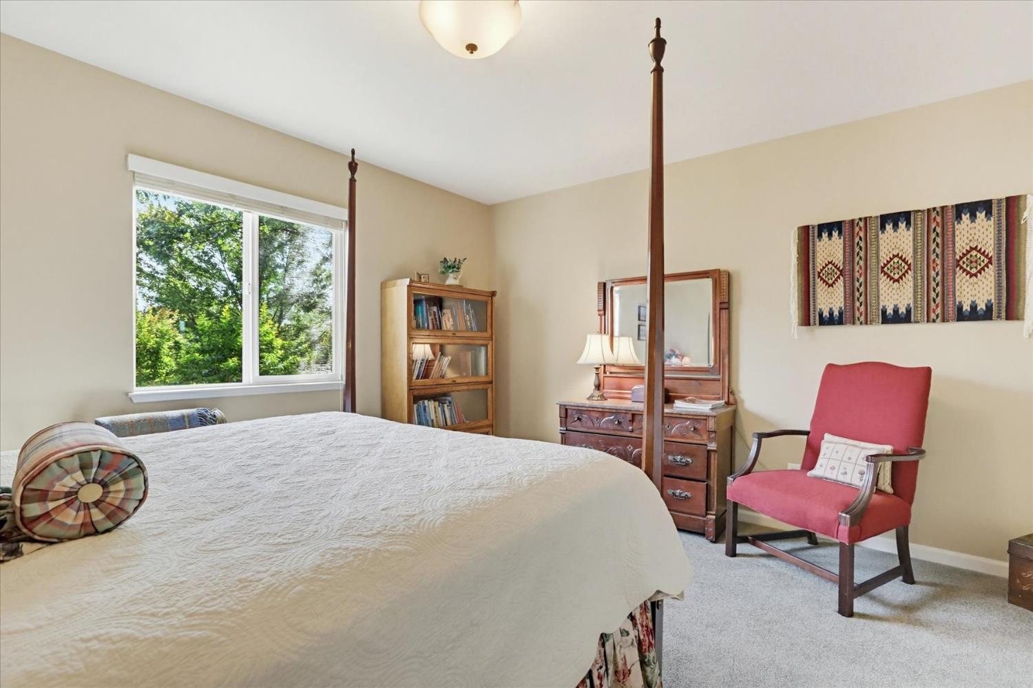 970 Morgan Ranch Drive Grass Valley, CA 95945 - Photo 31 of 76 a spacious bedroom with a bed and a window