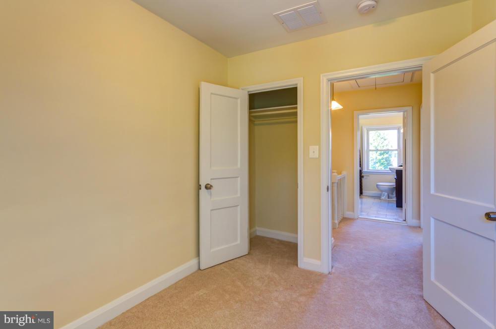 1027 Witherspoon Road Baltimore, MD 21212 - Photo 14 of 21 a view of a hallway with wooden shelves