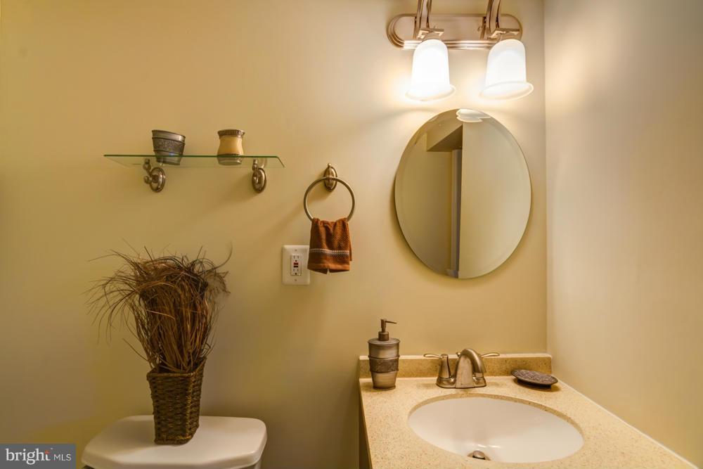 1027 Witherspoon Road Baltimore, MD 21212 - Photo 18 of 21 a bathroom with a sink and mirror