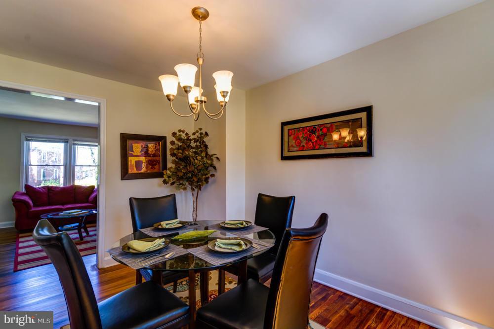 1027 Witherspoon Road Baltimore, MD 21212 - Photo 5 of 21 a view of a dining room with furniture and chandelier