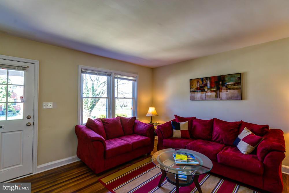 1027 Witherspoon Road Baltimore, MD 21212 - Photo 7 of 21 a living room with furniture and a window