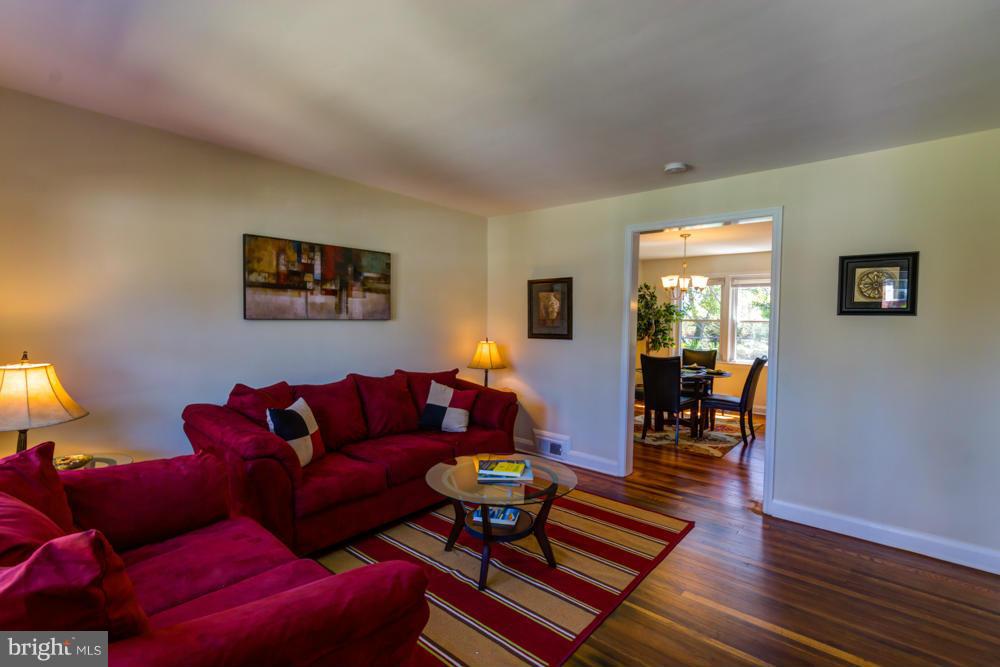 1027 Witherspoon Road Baltimore, MD 21212 - Photo 8 of 21 a living room with furniture and wooden floor