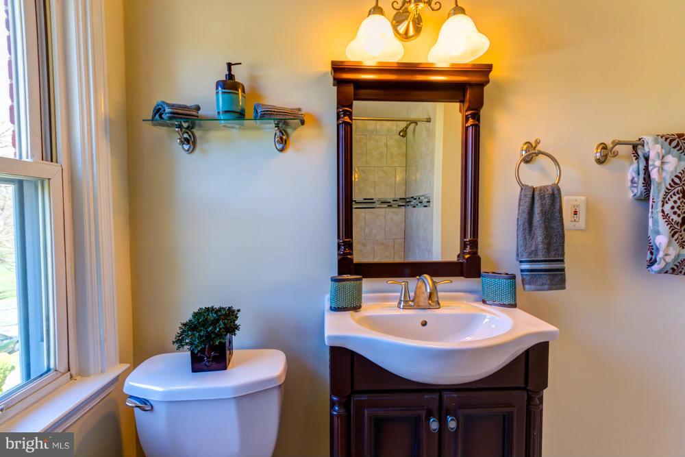 1027 Witherspoon Road Baltimore, MD 21212 - Photo 10 of 21 a bathroom with a sink and a mirror
